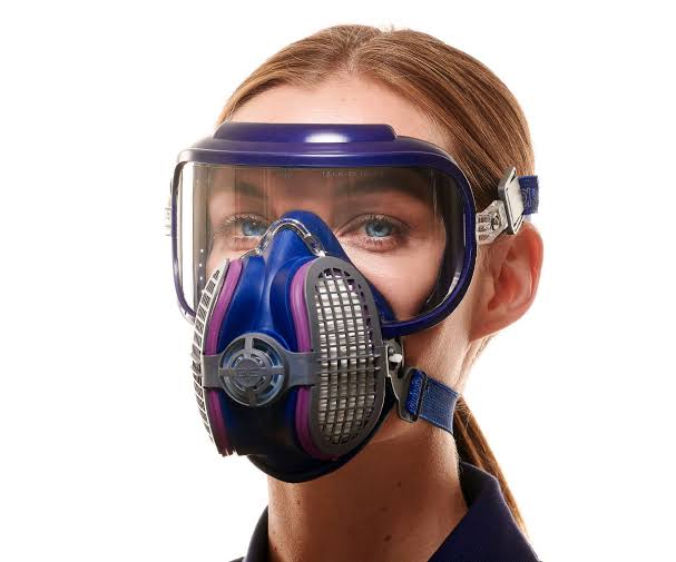 Woman wearing a full-face respirator with a clear visor